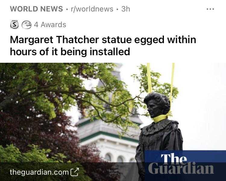 a close up of a statue of a person with a yellow ribbon