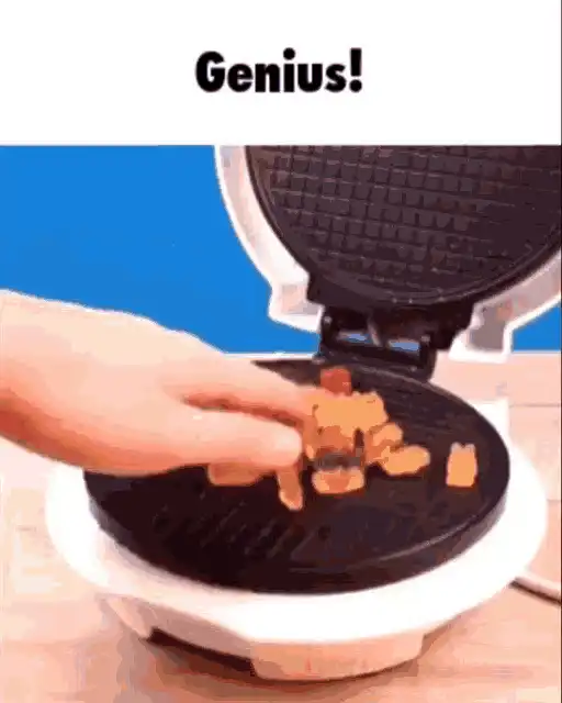 someone is making a waffle with a waffle maker on a table