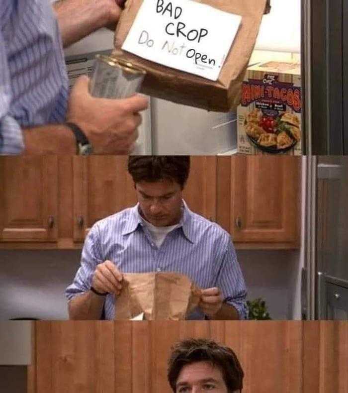 man in a kitchen with a bag of food and a sign that says bar - co