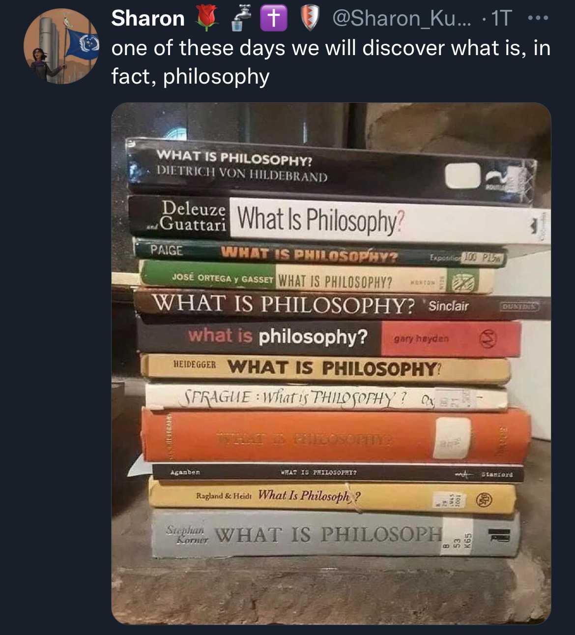 a close up of a stack of books on a table