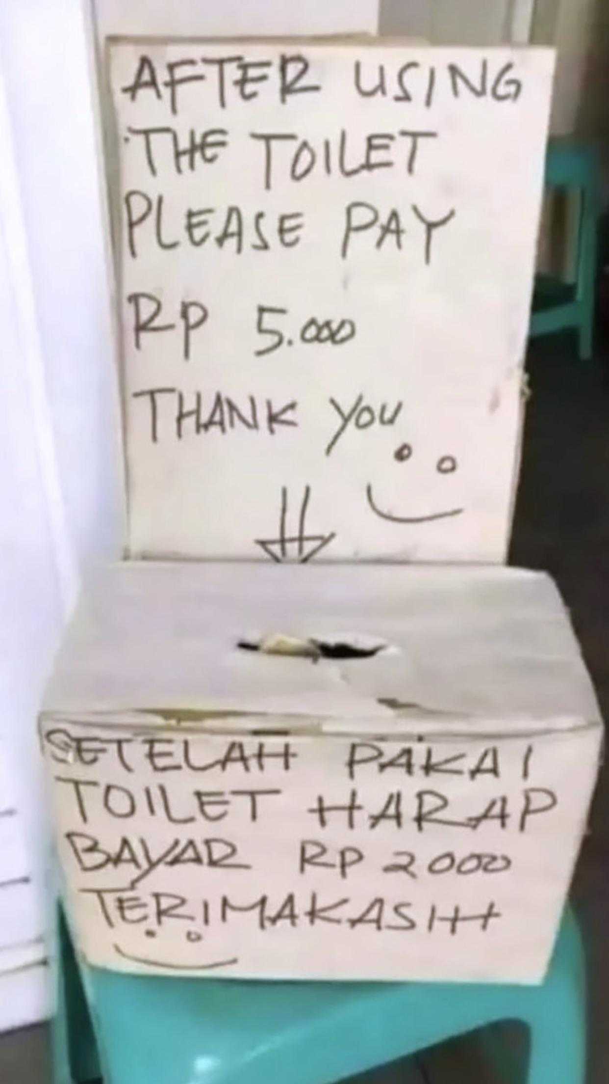 there is a sign that says after using the toilet please pay p p