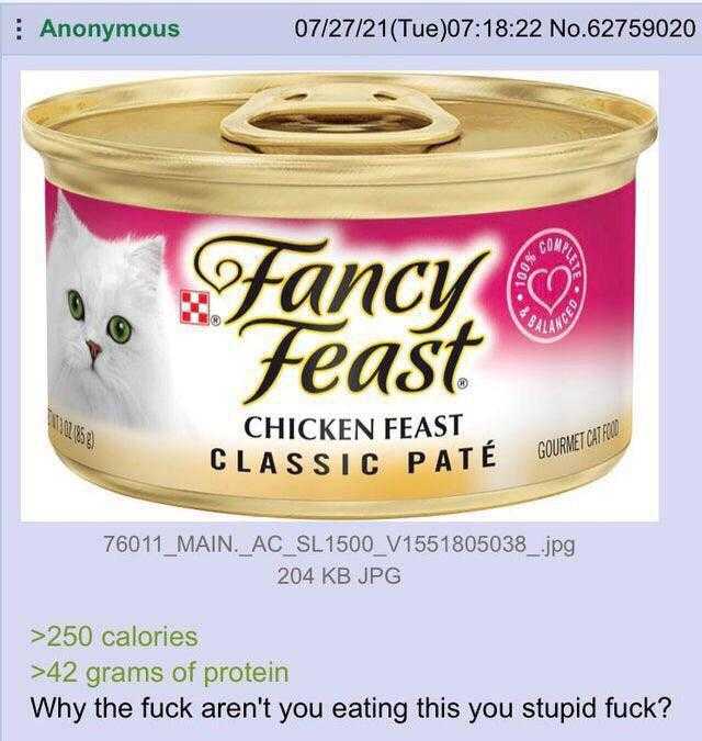 a close up of a tin of food with a cat in it