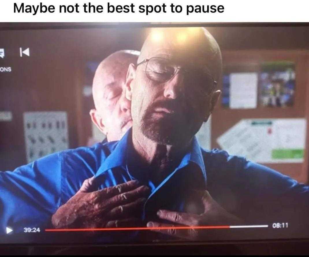 man in blue shirt adjusting his tie on tv