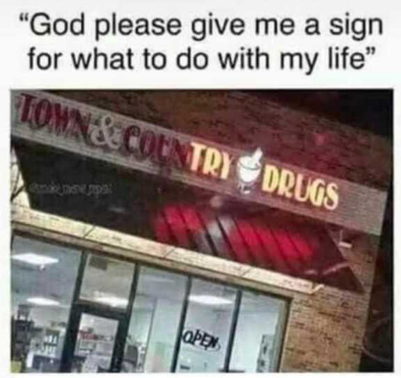 a close up of a sign on a building that says, god please give me a sign for what to do with my life