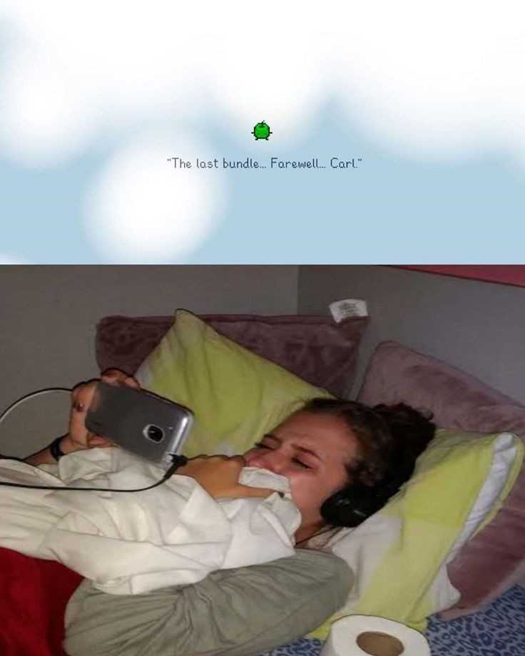 there is a woman laying in bed with a laptop and headphones