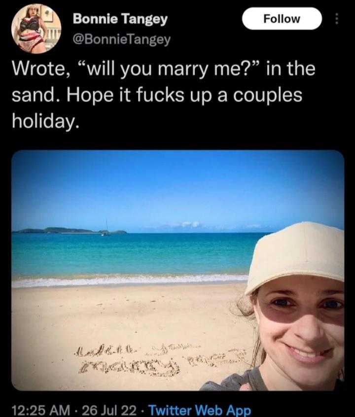 araff tweee with a picture of a woman on the beach