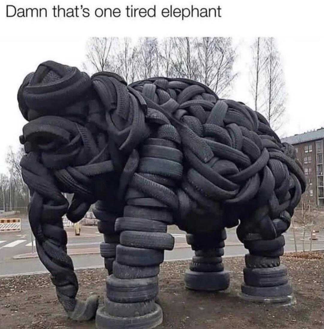 elephant made of tires sitting on the ground