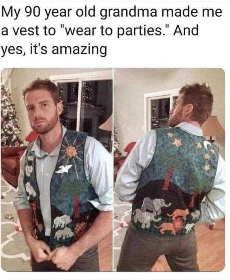 a man wearing a vest with a picture of a dog on it