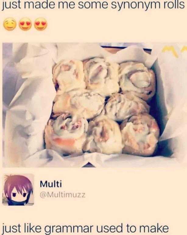 a close up of a box of doughnuts with a person in the background