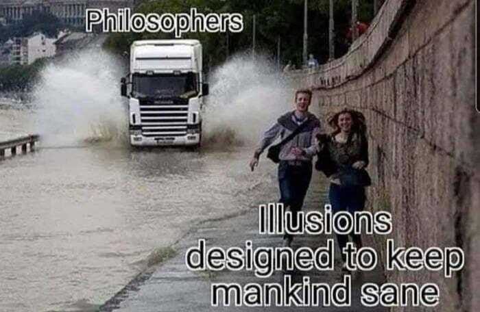 truck driving down a flooded street with a man and woman walking by