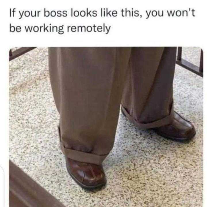 man in brown pants and brown shoes standing on a floor