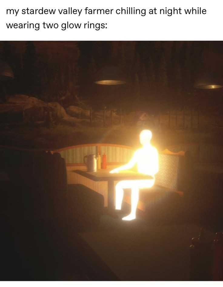 there is a man sitting on a bench with a glowing light on it