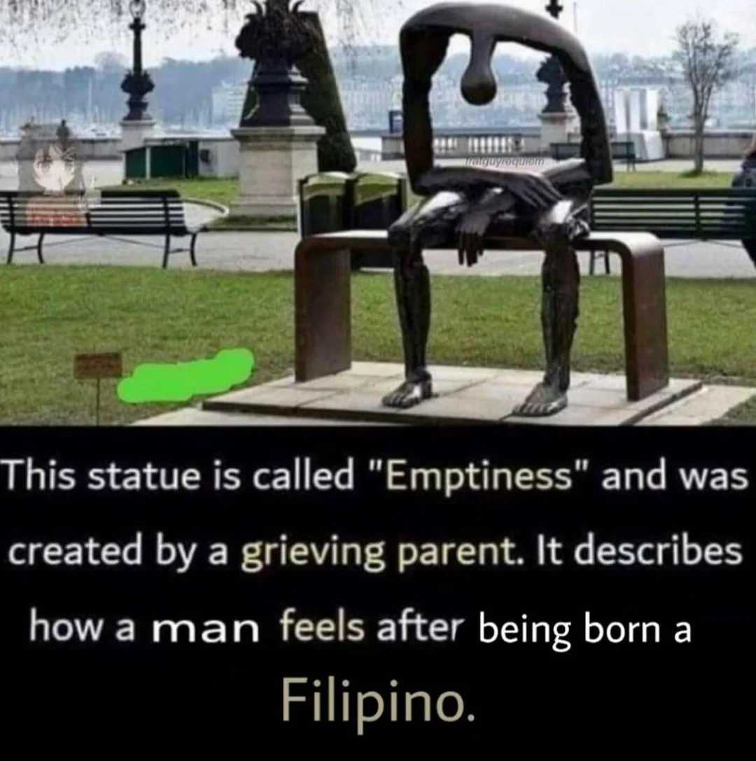 there is a statue of a man sitting on a bench