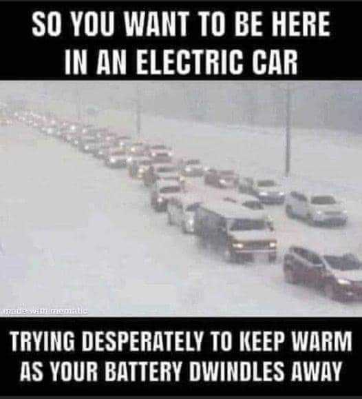 a picture taken from a car window shows a line of cars driving down a snowy road