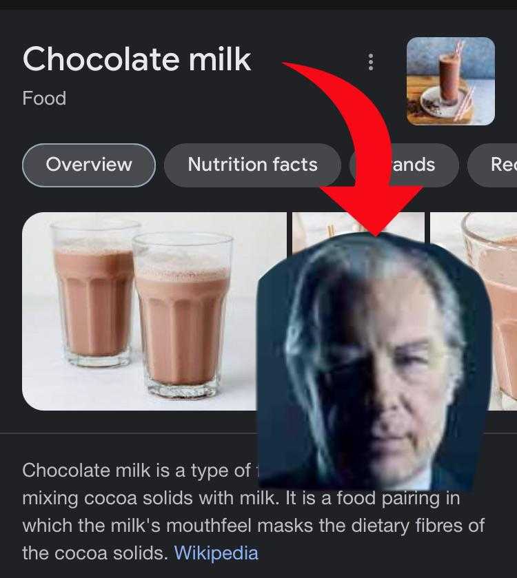 a close up of a cell phone with a picture of a man and a glass of milk