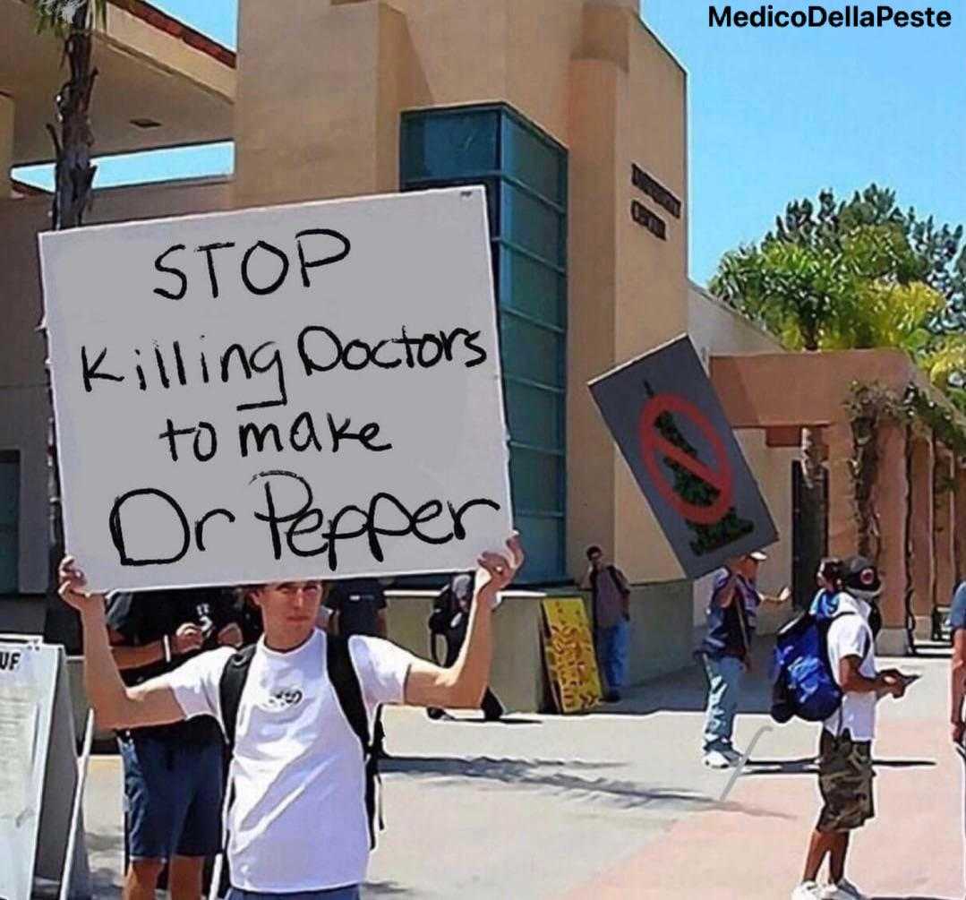 there is a man holding a sign that says stop killing doctors to make on pepper