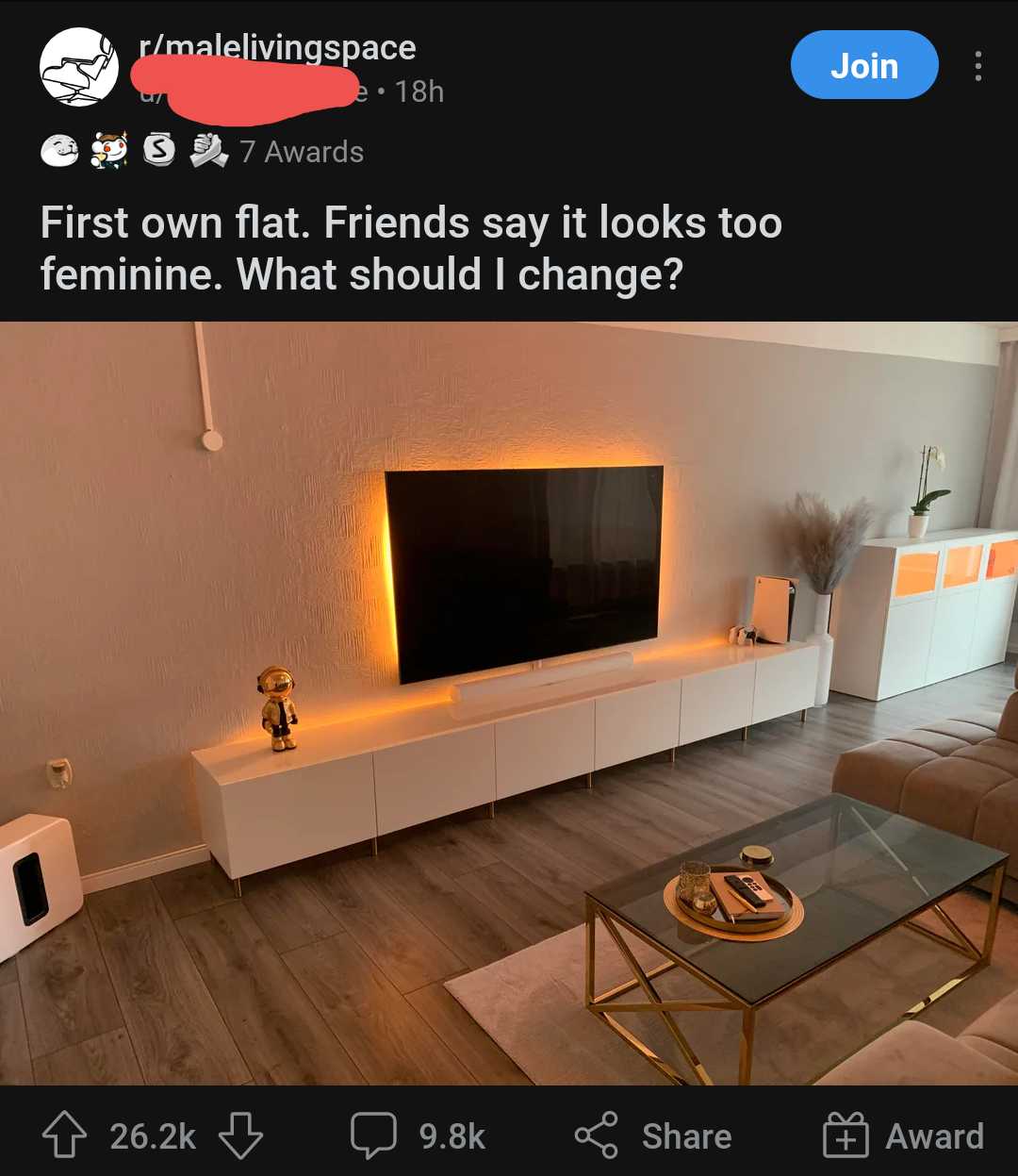 there is a picture of a living room with a tv and a couch