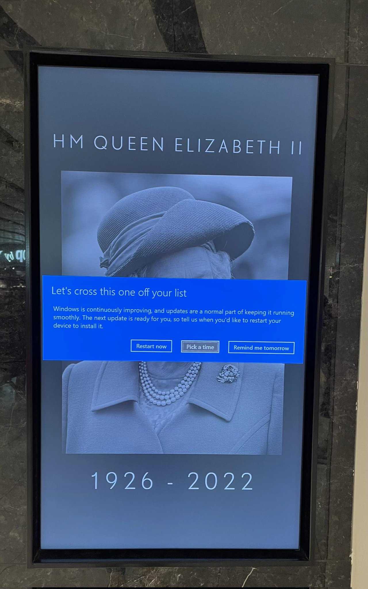 poster of queen elizabeth in blue on a wall