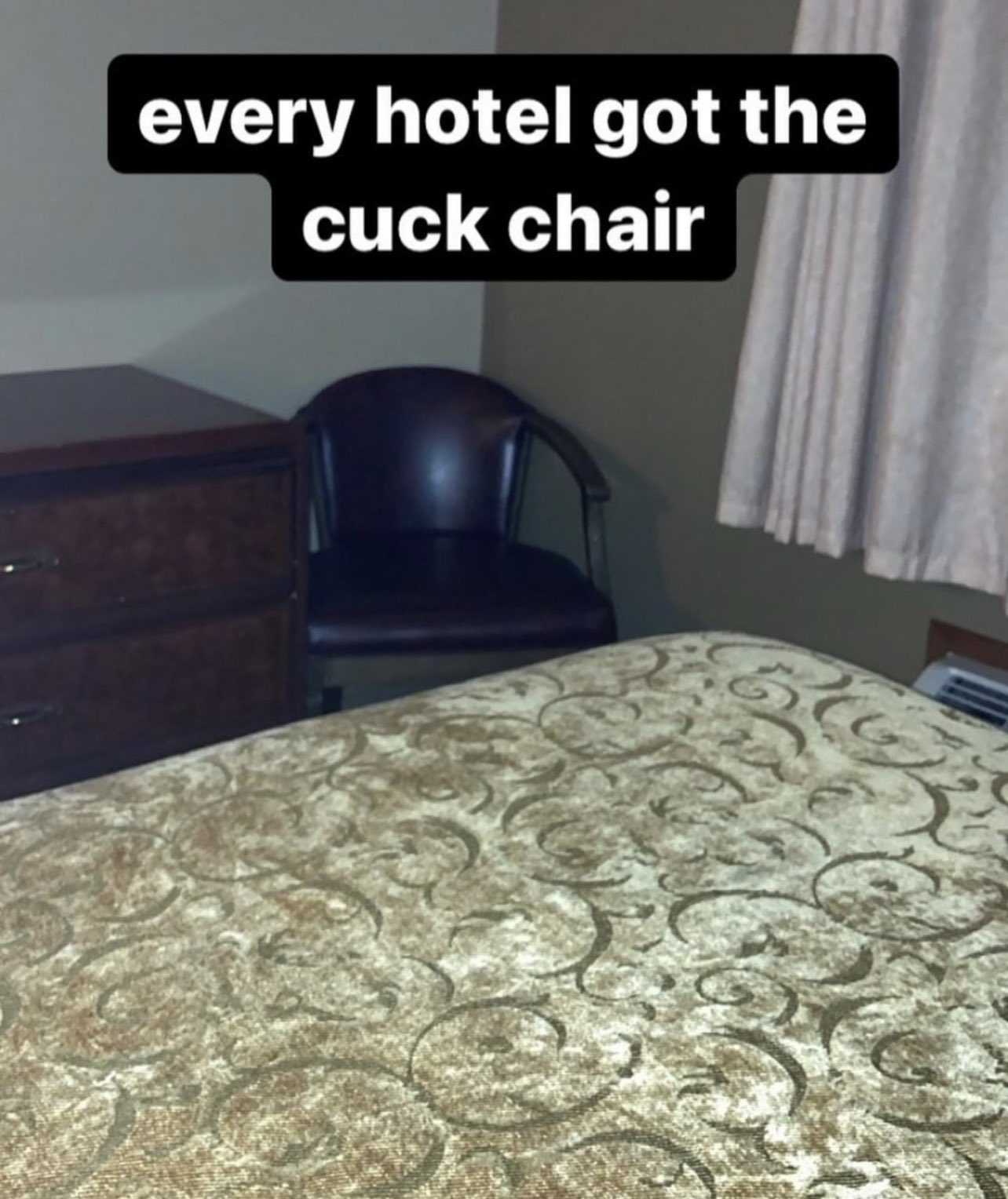 there is a bed with a chair and a window in the room