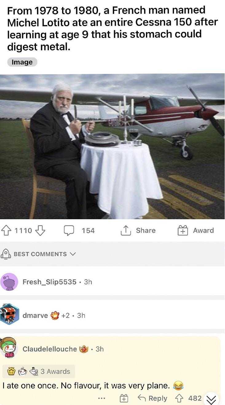 a screenshot of a man sitting at a table with a plane in the background