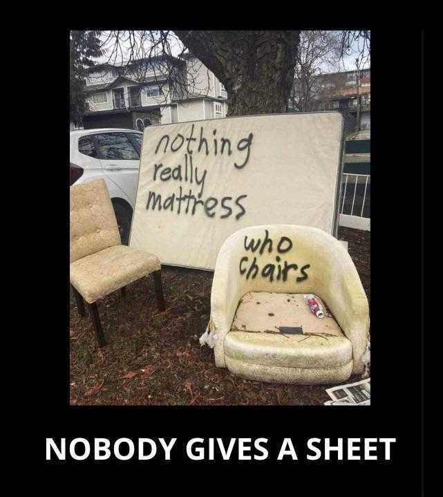 there is a sign that says nobody gives sheets to a chair