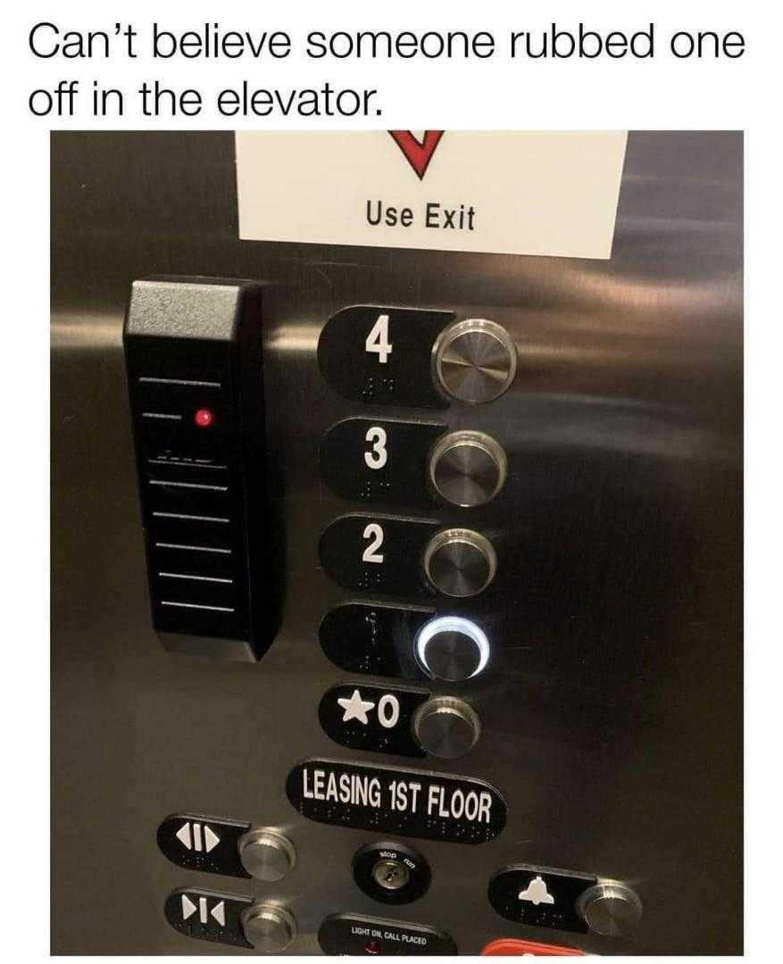 a close up of a elevator with buttons and a sign on it