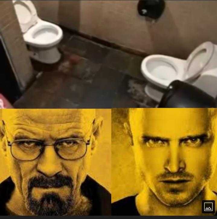 image of a man with glasses and a beard in a bathroom