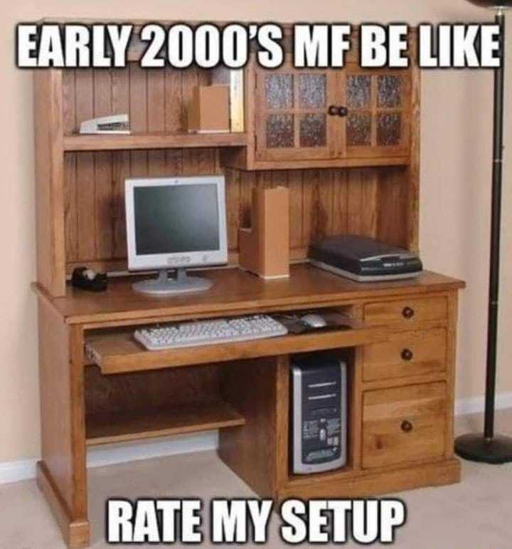 computer desk with a computer monitor and keyboard on it