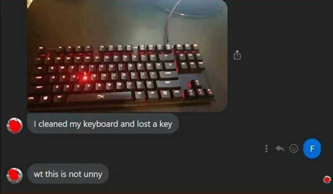 a close up of a keyboard with a red light on it