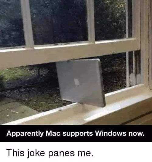 a close up of a laptop computer sitting on top of a window sill