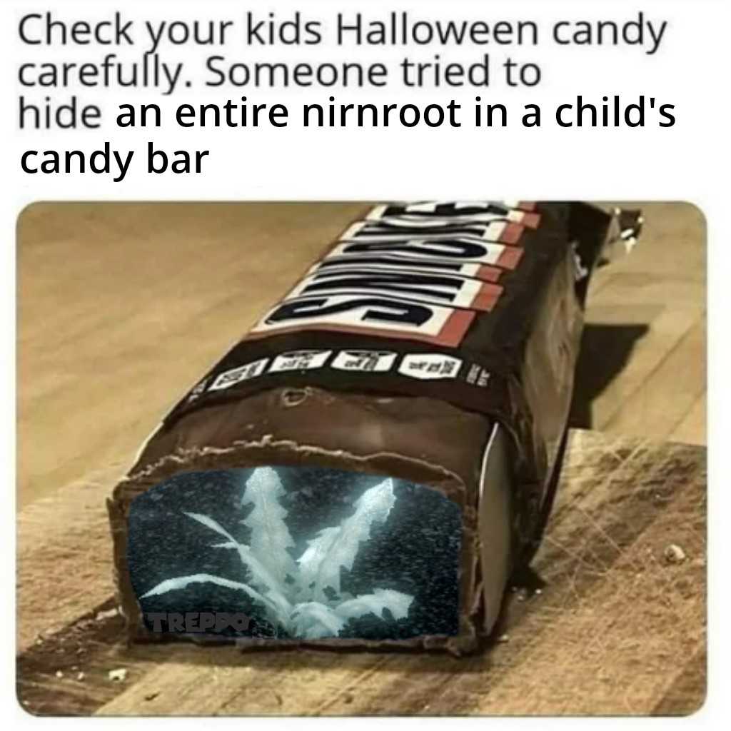 a close up of a candy bar with a child ' s hand on it