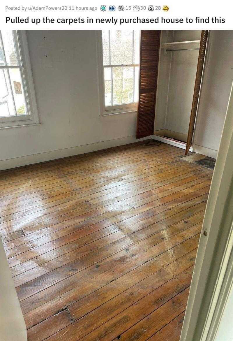 wood floor in a room with a window and a door