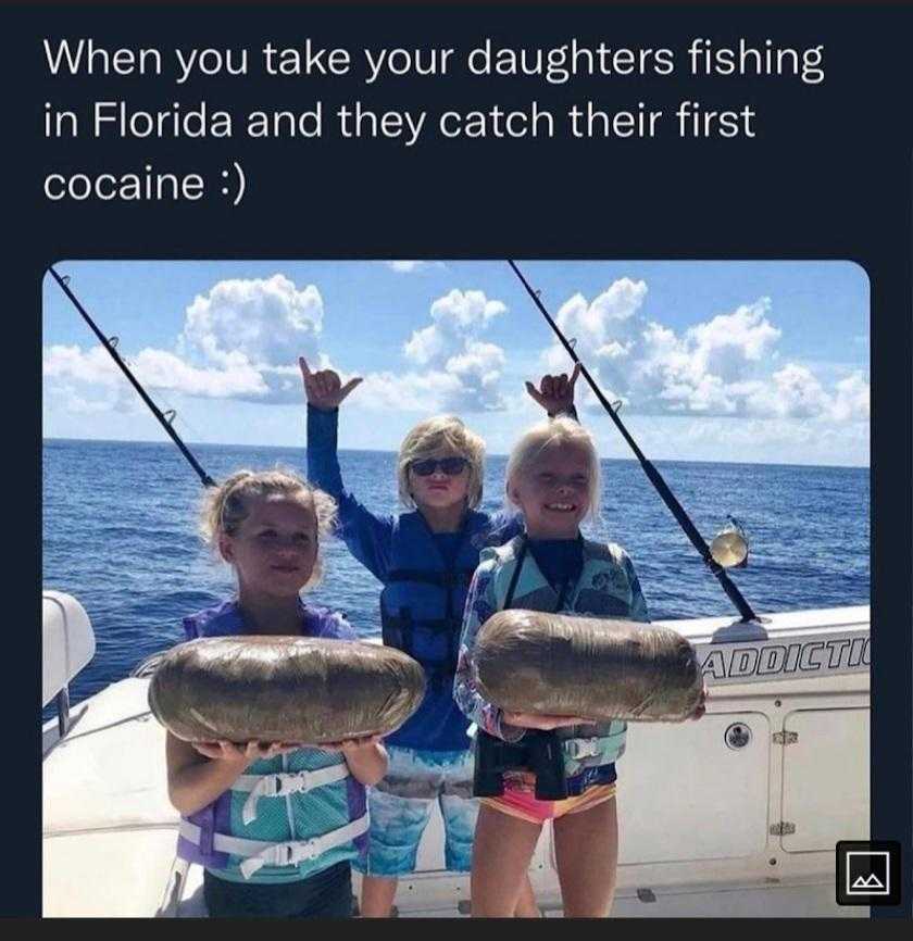 two girls holding fish on a boat with caption of caption