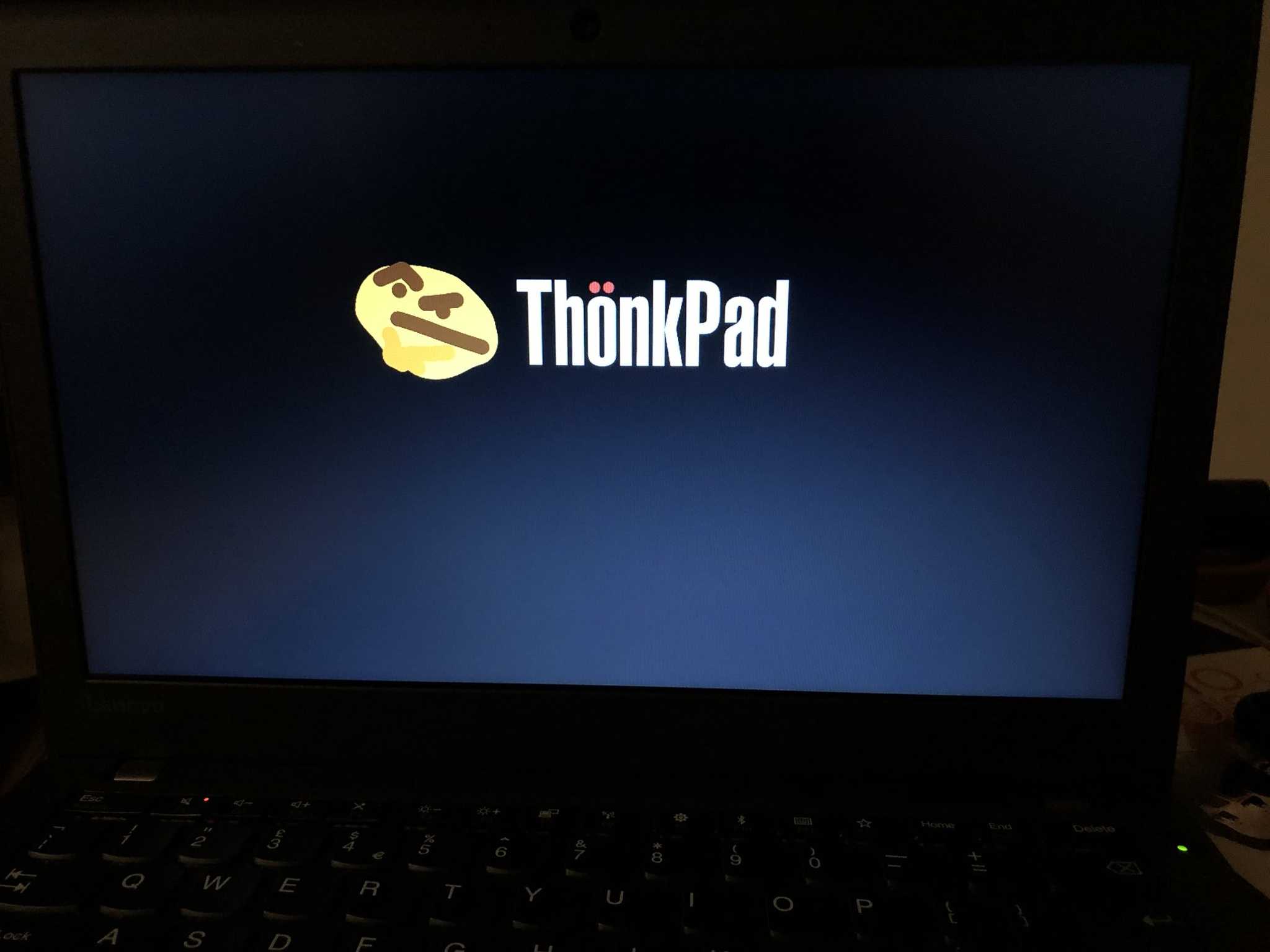 laptop with a thinkpad logo on the screen