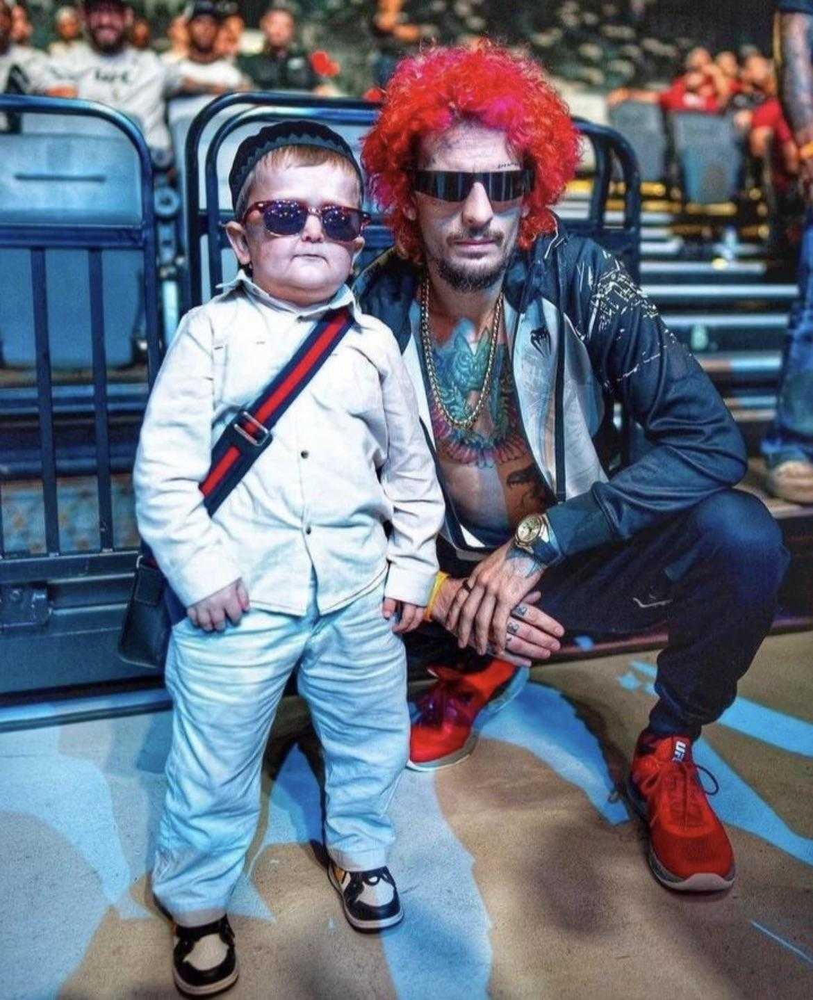 araffe and a child dressed up as a rock star