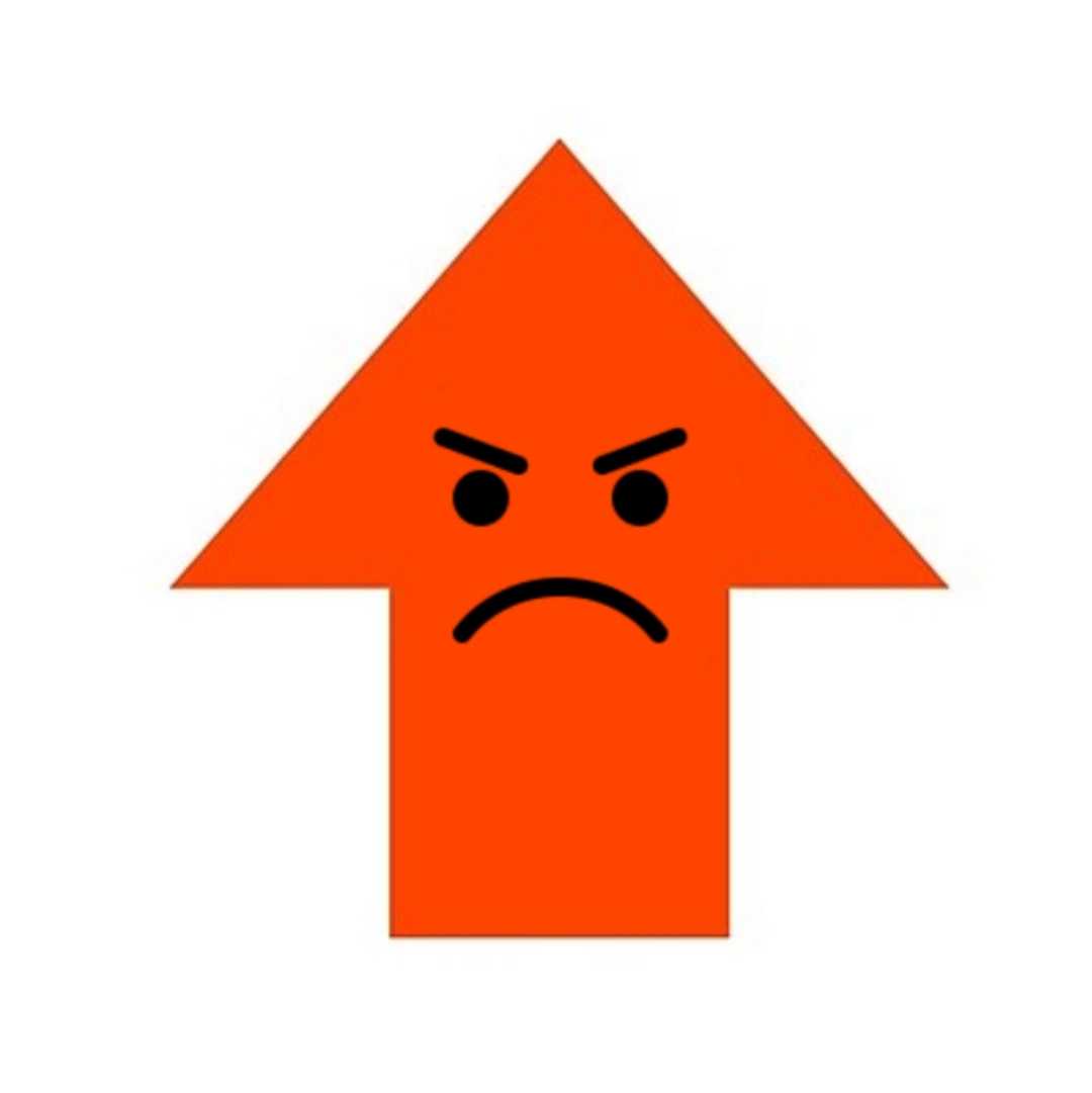 a close up of a red arrow with a sad face