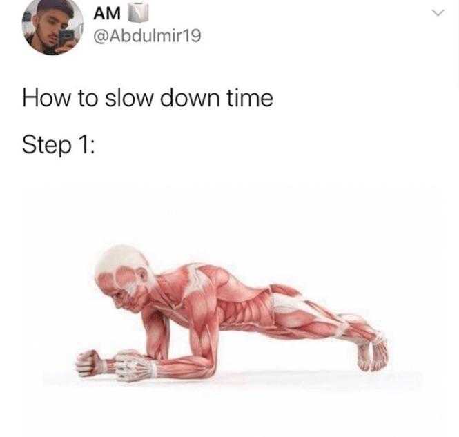 a close up of a person doing a plank on a white surface