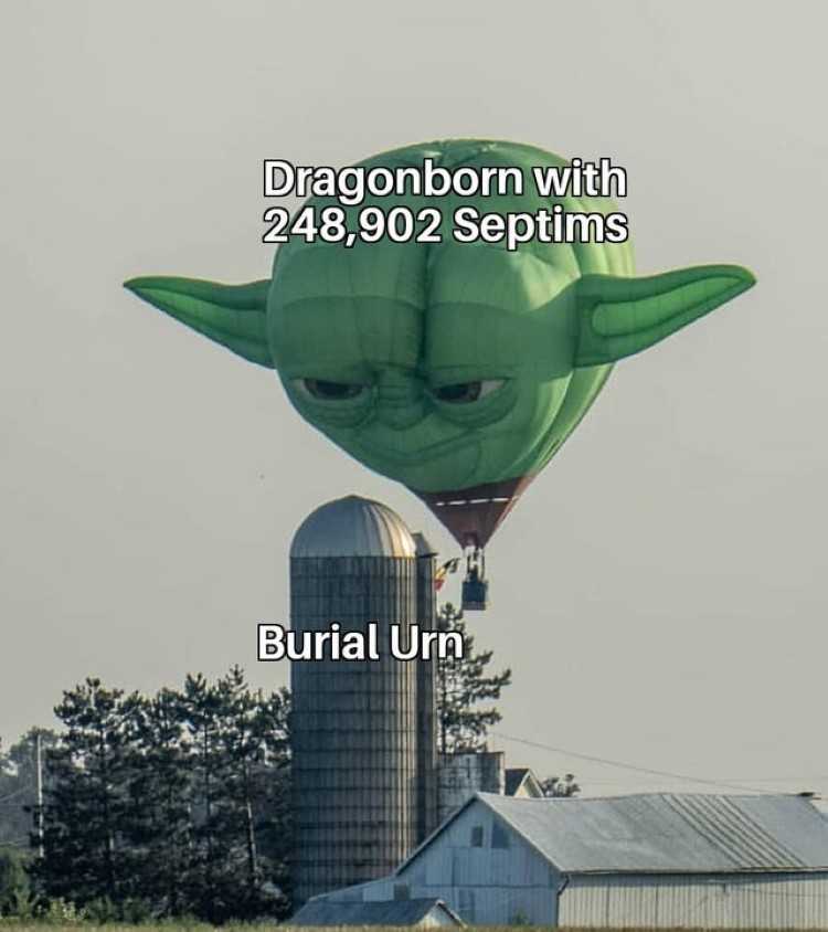 a close up of a large green balloon with a face on it