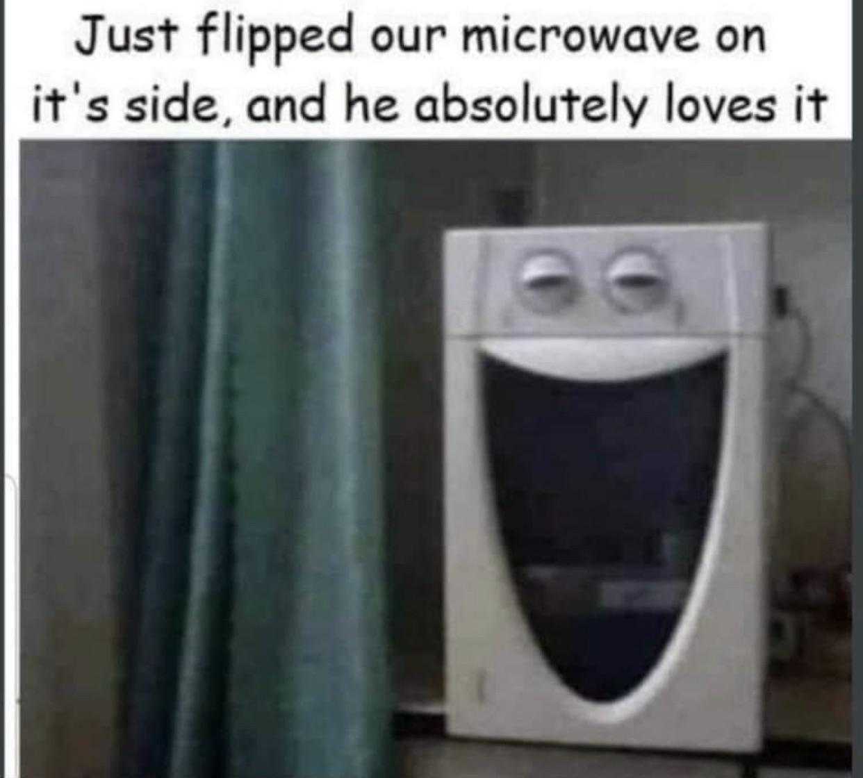 there is a picture of a microwave with a funny face on it