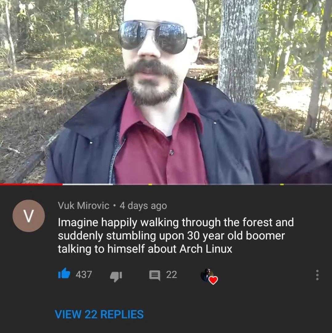 there is a man with sunglasses on taking a selfie in the woods