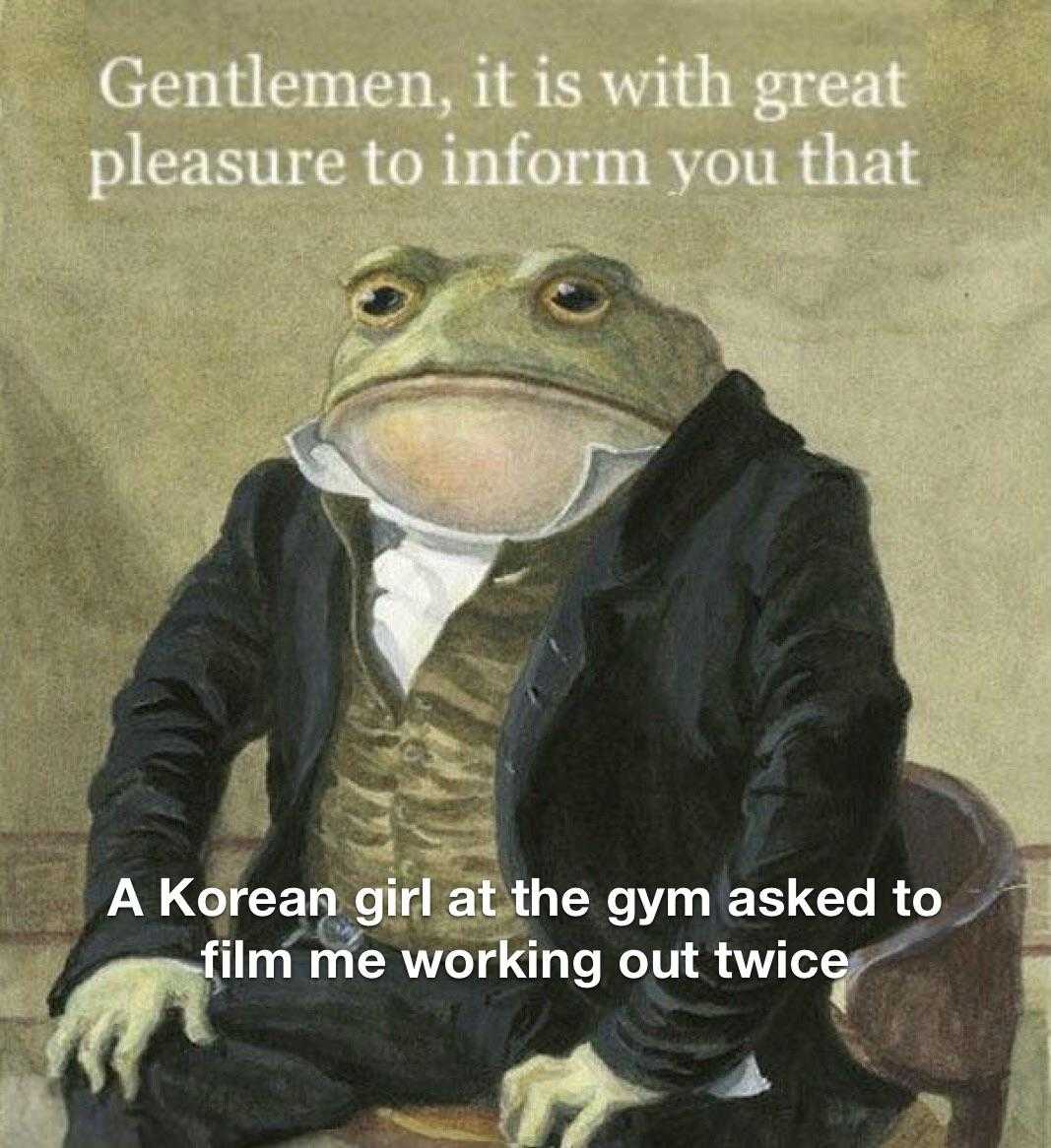 there is a frog that is sitting on a chair with a suit on