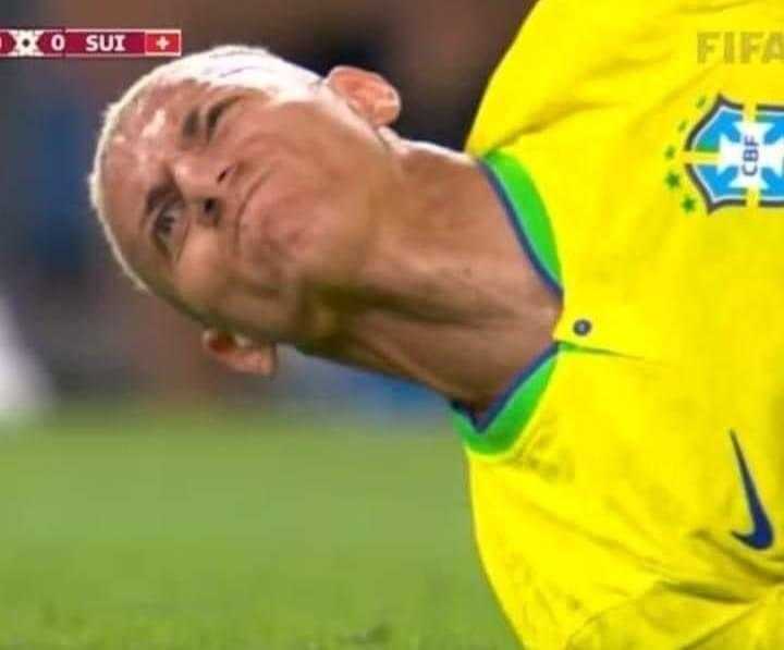 soccer player laying on the ground with his head on the ground