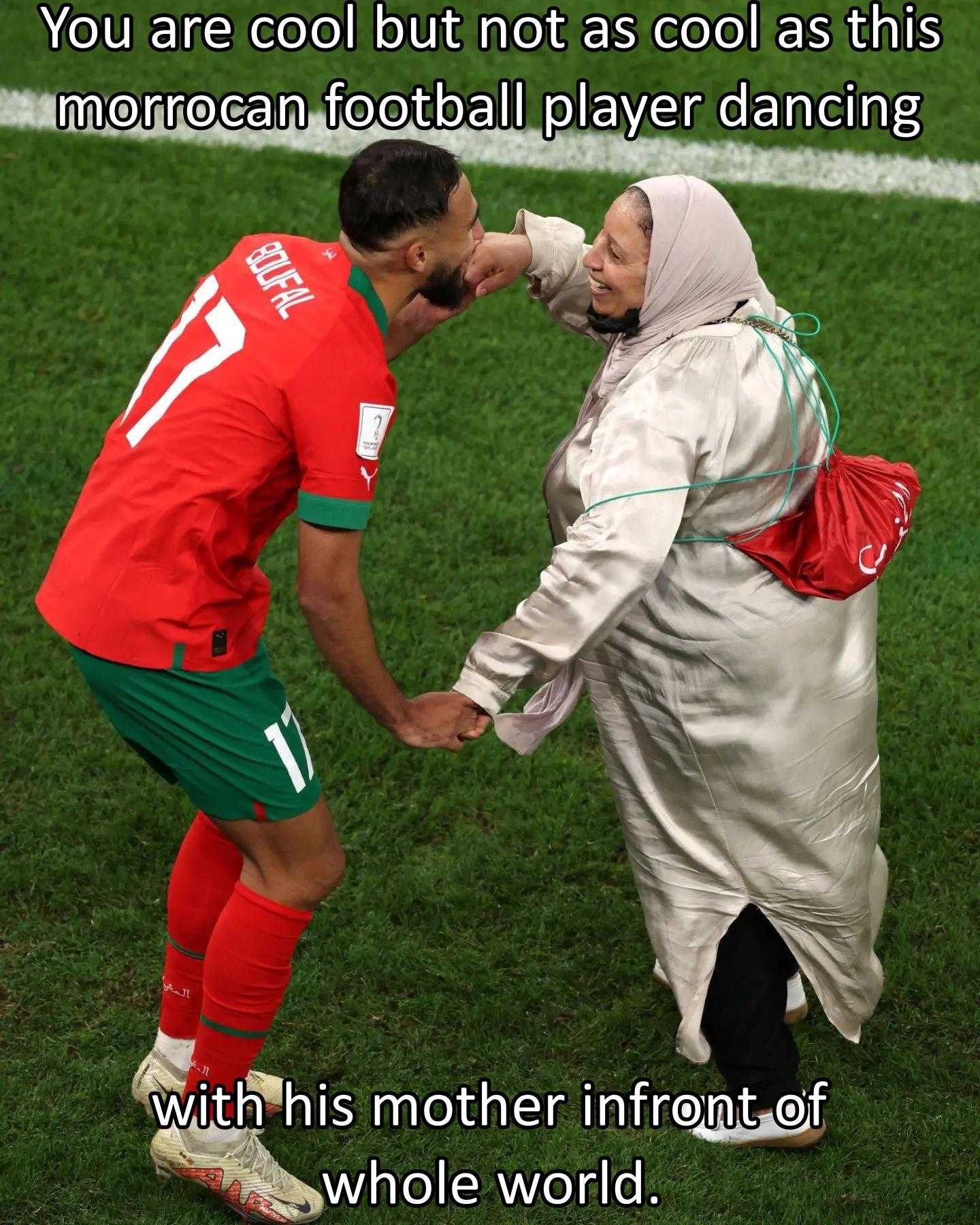 there is a woman and a man shaking hands on a soccer field