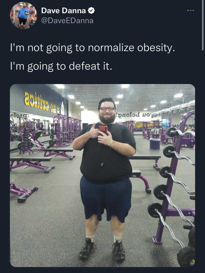 man in a gym room with a weight scale