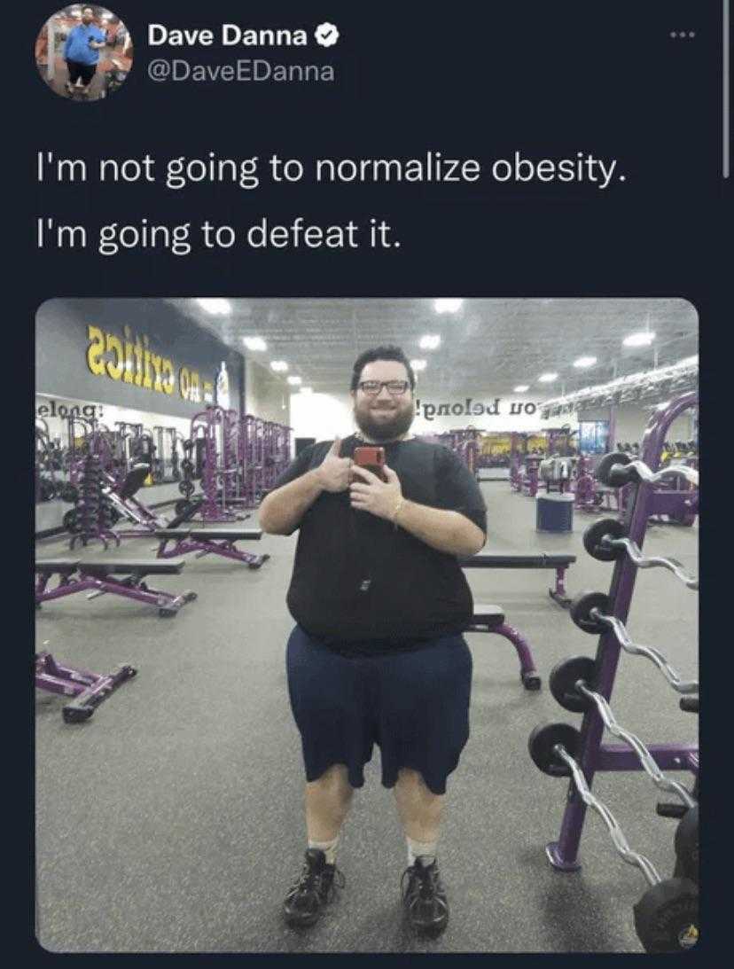 man in a gym room with a weight scale