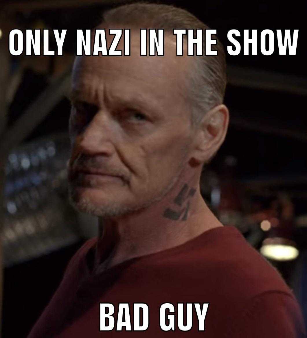 man with a tattoo on his chest and a caption that says, only nazi in the show bad guy