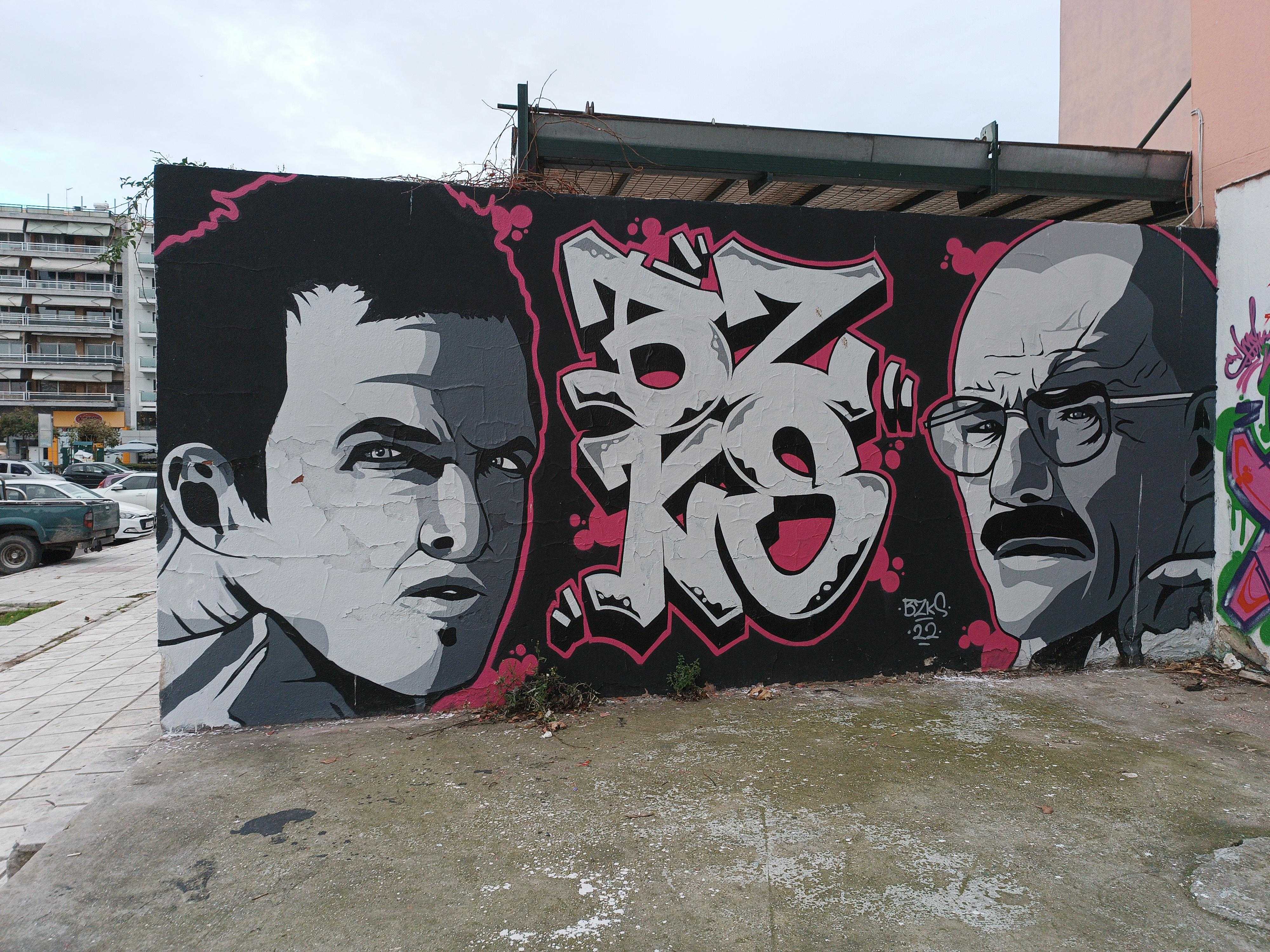 graffiti on a wall of a building with a man and a woman