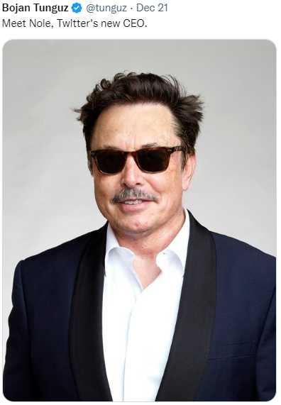 a close up of a man wearing sunglasses and a suit