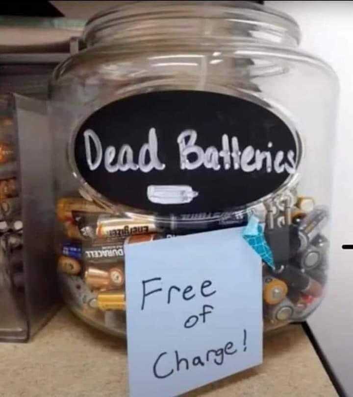 there is a jar of batteries with a sign on it